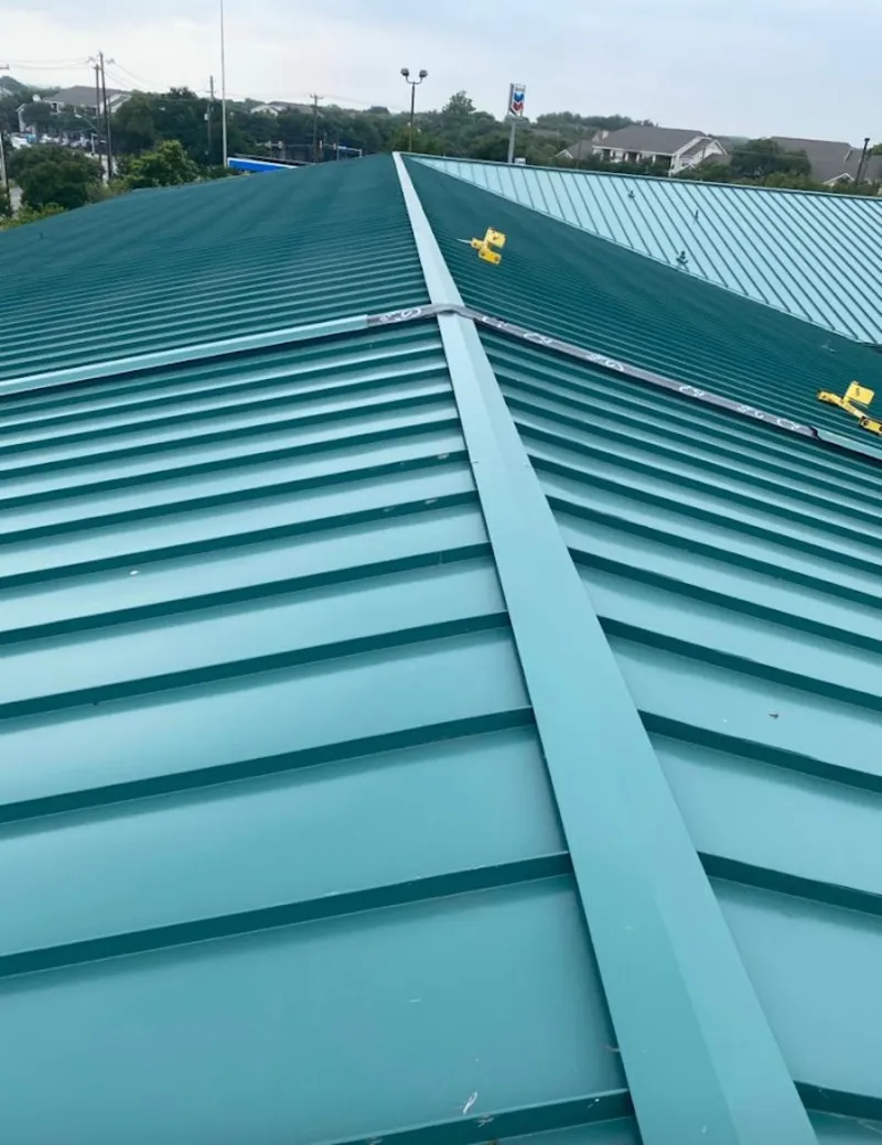 Green commercial metal roof ridge and valley for Metal Roof Repair in Lunenburg